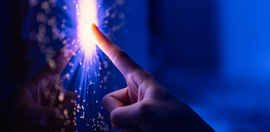 A human hand touching a digital screen.
